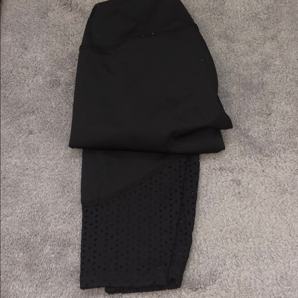 black leggings with mesh at the bottom